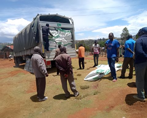 a lorry delivering fertilizer to a farmers cooperative society