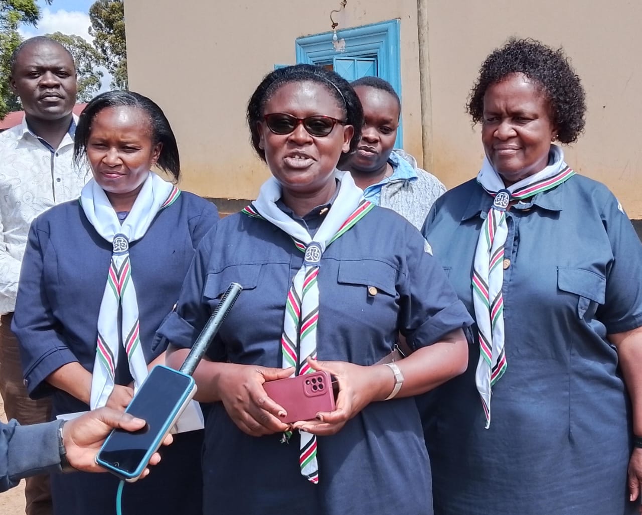 Rashid Mwanaisha, Kenya Girl Guides Association Trans Nzoia Commissioner (center) speaking to the press at Kitale School primary. 