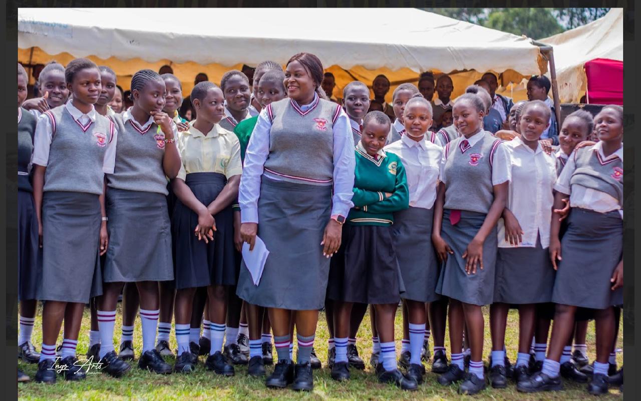 Founder and CEO Hers Haven Initiative Namalwa Chesoli with St. Augustine Girls High School Lukhuna students.