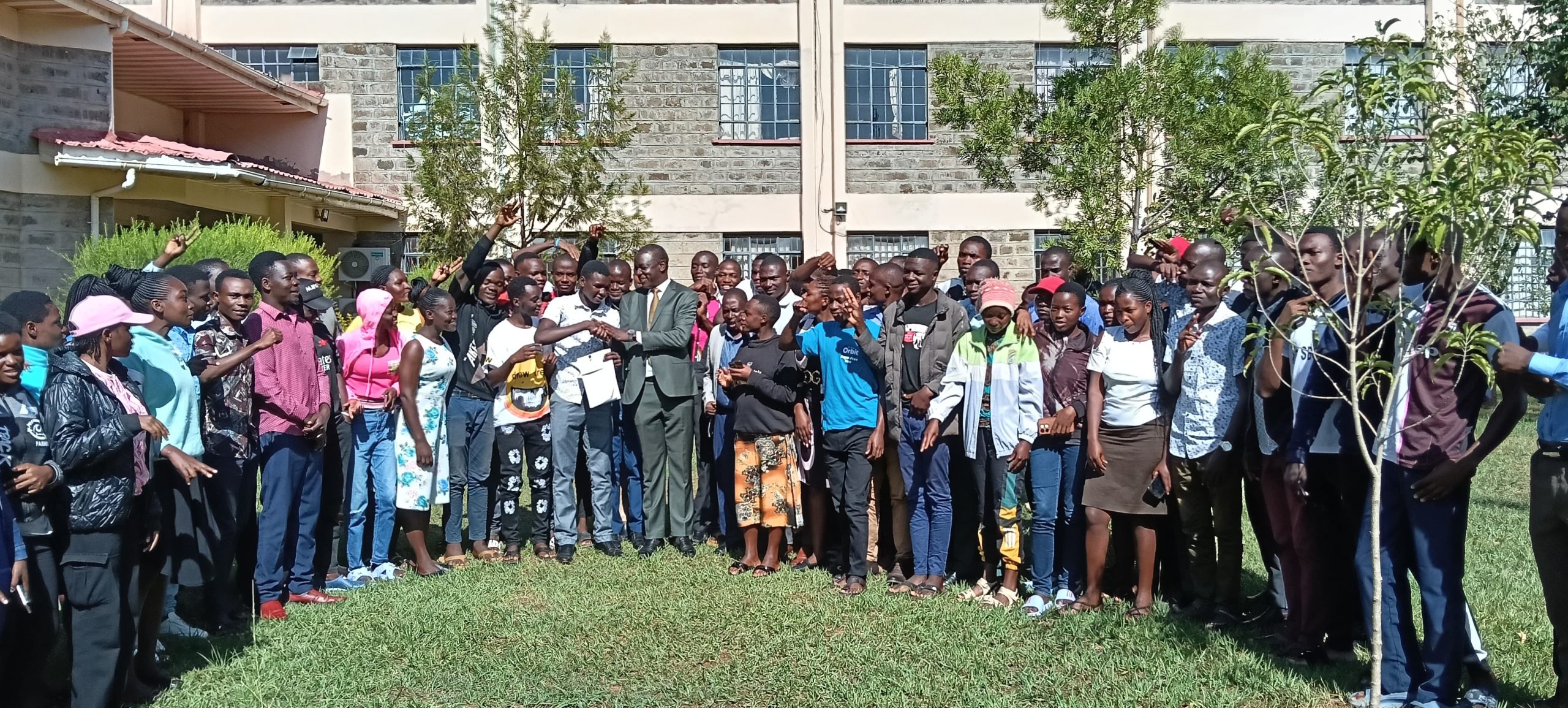 Kanduyi MP John Makali with some of the students who benefited from the NG-CDF bursary kitty