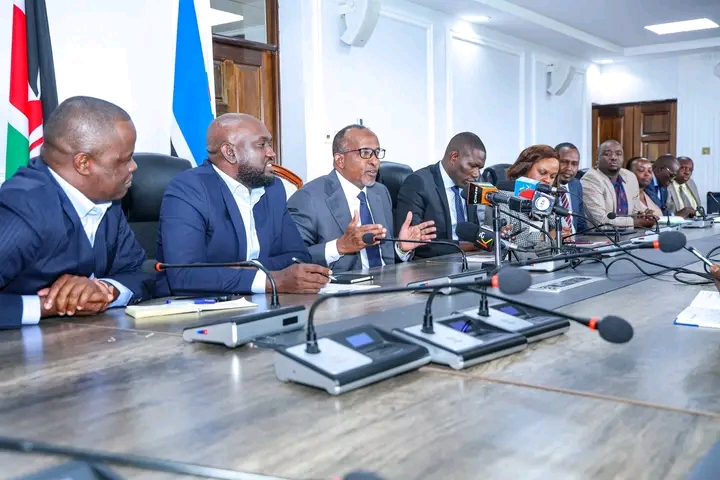 CS Aden Duale with other health officials during a media briefing at Afya House 