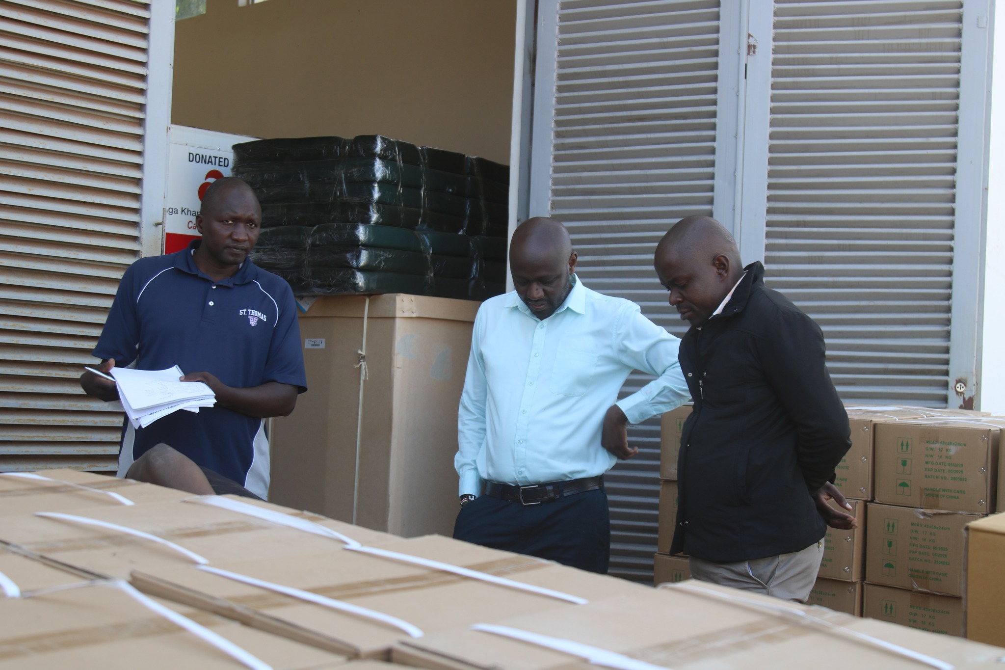 Trans Nzoia County Director of Medical Services, Dr. Isaac Babu Kisang’ani checking medical supplies