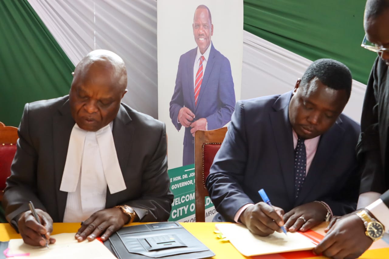 Uasin Gishu Sports Robert Kemei with Eldoret High Court Judge Reuben Nyakundi 