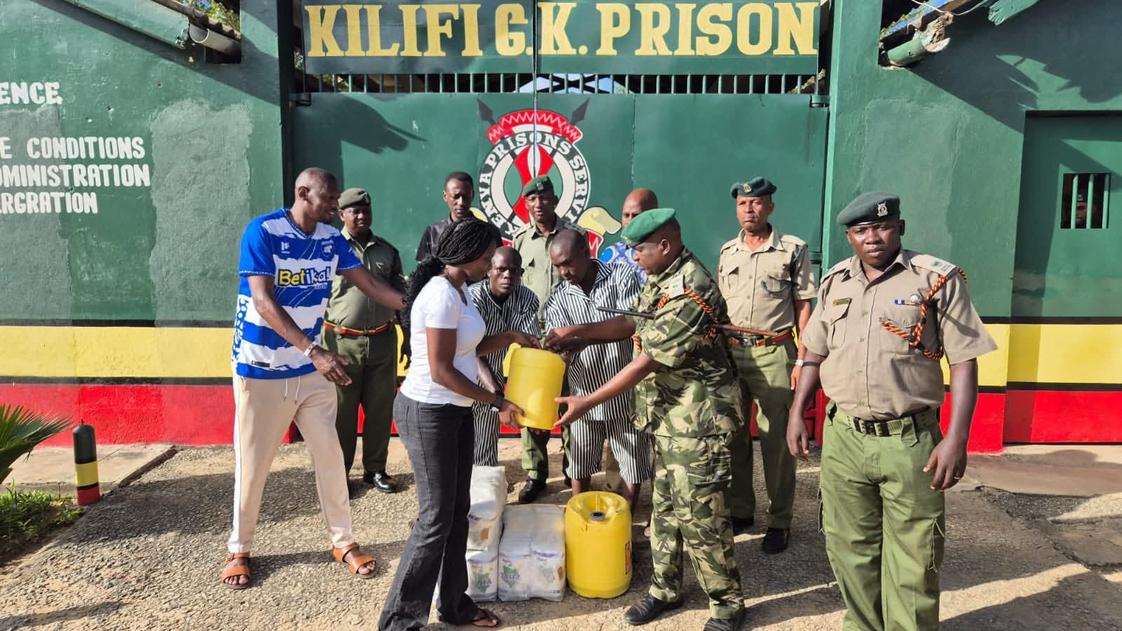 MPs handing over food donations to Kilifi GK Prison officials 