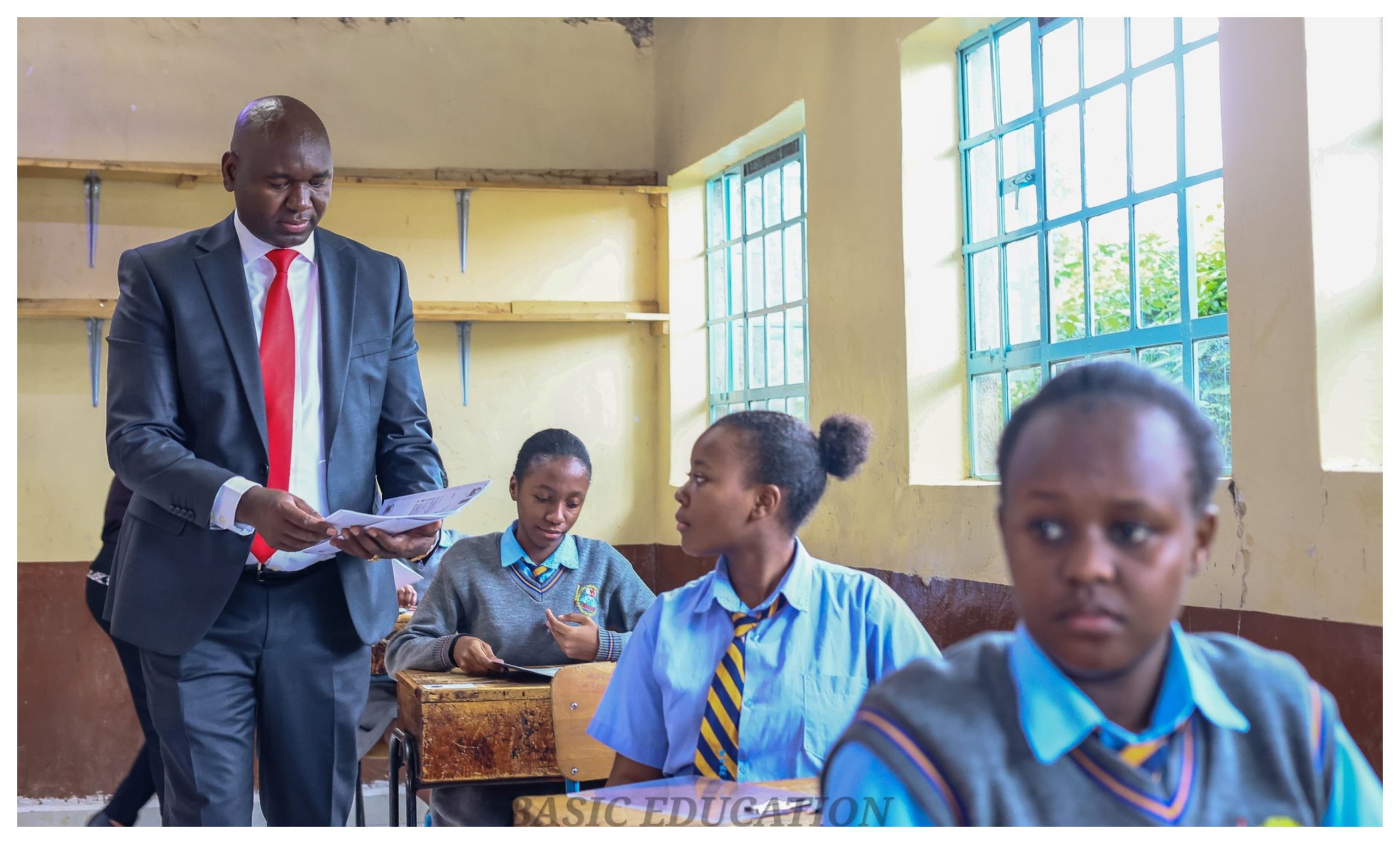 Basic Education PS Prof Julius Bitok distributing KCSE exam papers at Musa Gitau Girls High School
