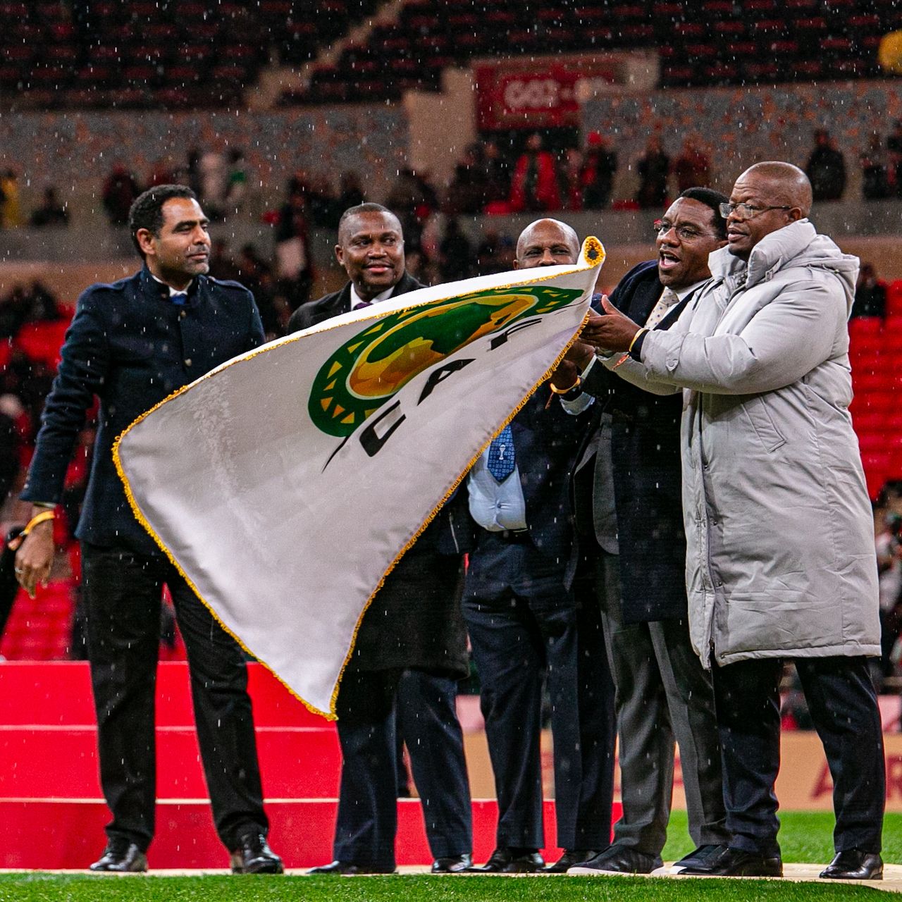 CAF President Dr Patrice Motsepe formally handed over the AFCON tournament flag to Kenya, Uganda and Tanzania