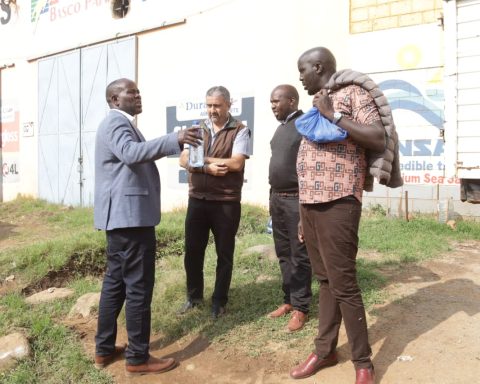 Roads CECM Abraham Seerem engages with some land owners in Eldoret.