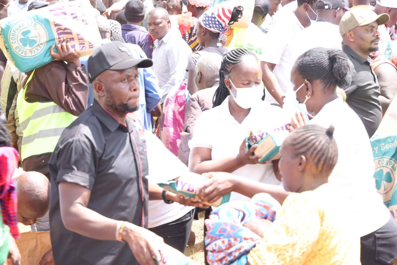 Natembeya distributing seeds to farmers 
