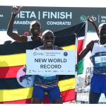 Ugandan distance runner Jacob Kiplimo celebrates setting new world half marathon record.