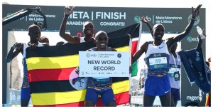 Ugandan distance runner Jacob Kiplimo celebrates setting new world half marathon record.