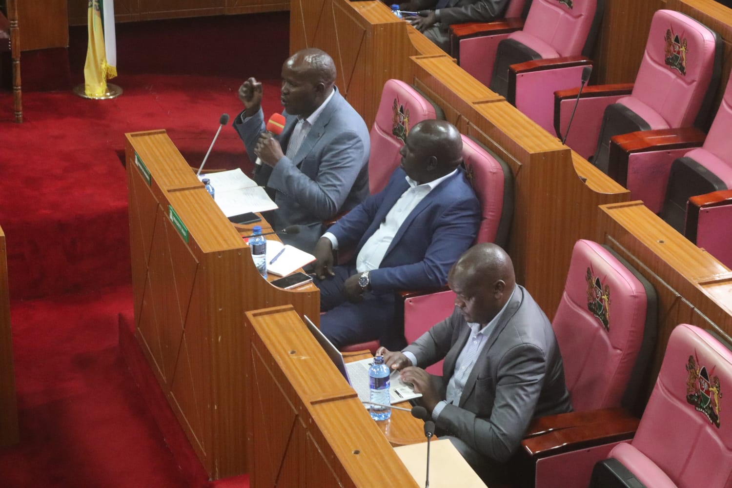 Uasin Gishu Roads CECM Abraham Serem (with mic) alongside Chief Officer Geoffrey Tanui and Director of Roads Engineer Julius Ronoh when they appeared before the County Assembly Special Committee on Roads