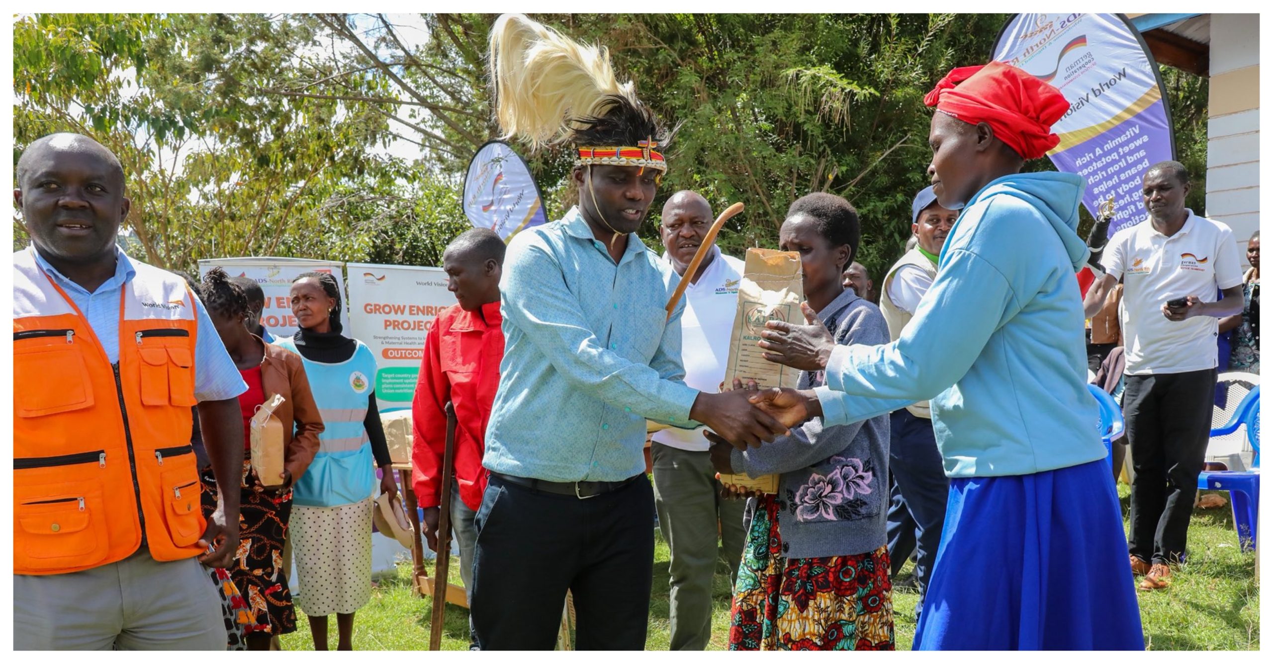 Elgeyo Marakwet Governor Wisley Rotich hands over a packet of Nyota beams to a farmer in Chesoi