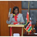 Kimumu MCA Sarahj Malel (c) takes oath as her Langas counterpart Francis Muya and Uasin Gishu County Assembly Speaker Phillip Muigei looks on.