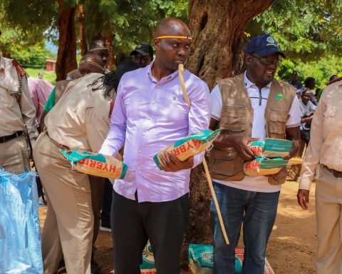 Elgeyo Marakwet Governor Wisley Rotich with packets of seeds.