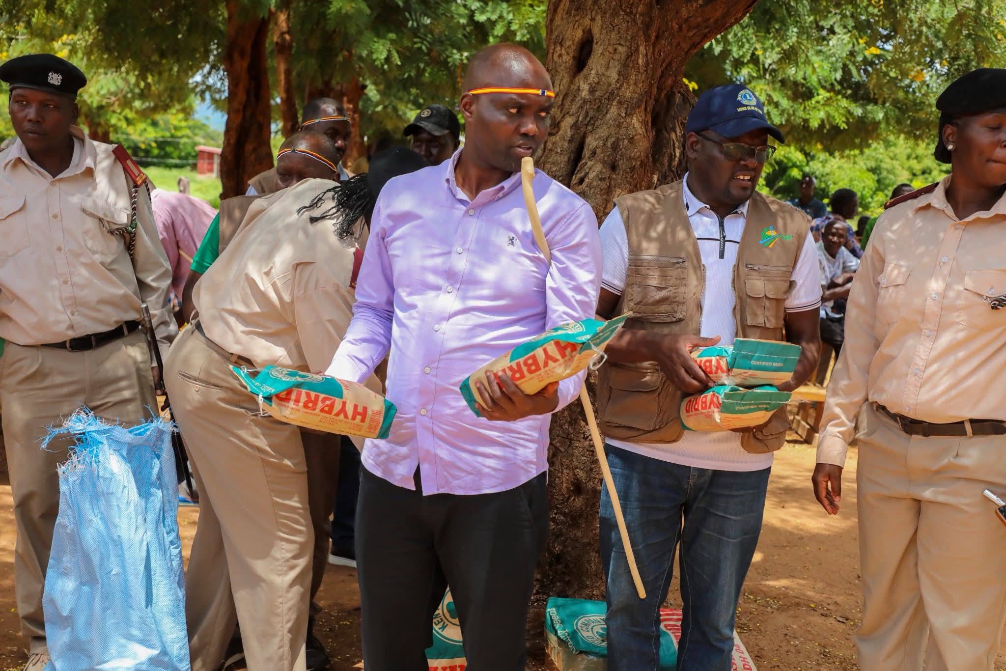 Elgeyo Marakwet Governor Wisley Rotich with packets of seeds.