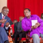 President Ruto chats with COTU secretary general Francis Atwoli during Labour Day celebrations in Vihiga