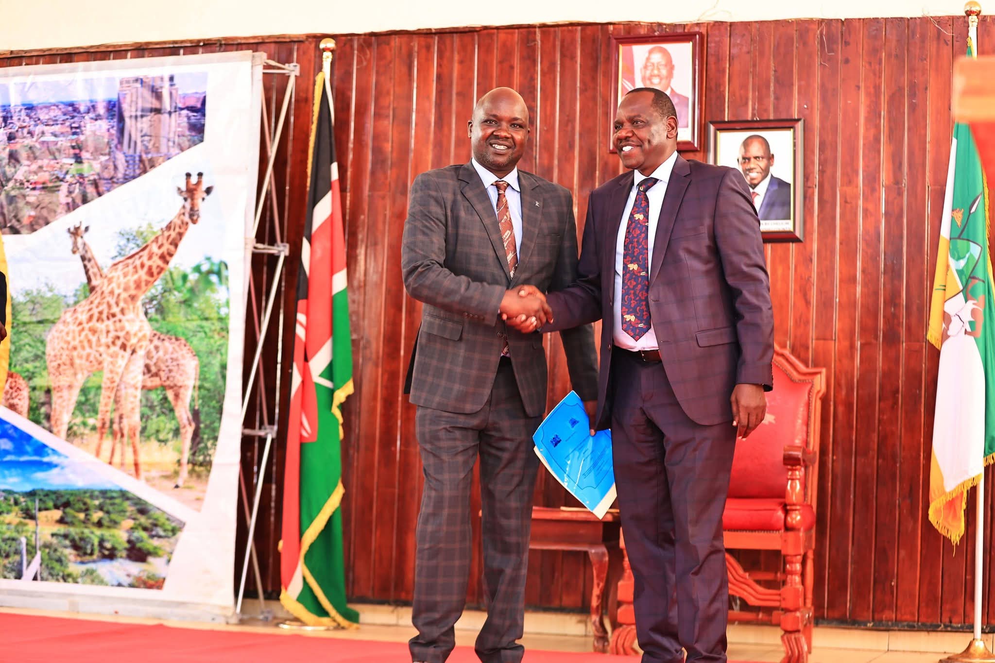 Uasin Gishu Governor Jonathan Bii with new Trade CECM Dr Phillip Chebunet 