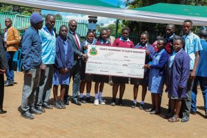 Elgeyo Marakwet Governor Wisley Rotich with some beneficiaries of the Ksh 73m bursary allocation