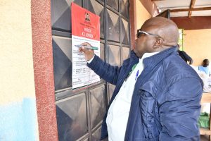 PPB Head of Good Distribution Practices and Enforcement Julius Kaluai closing an unlicensed medicine outlets during an operation in Nairobi and Kajiado.