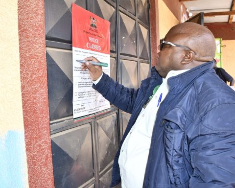 PPB Head of Good Distribution Practices and Enforcement Julius Kaluai closing an unlicensed medicine outlets during an operation in Nairobi and Kajiado.