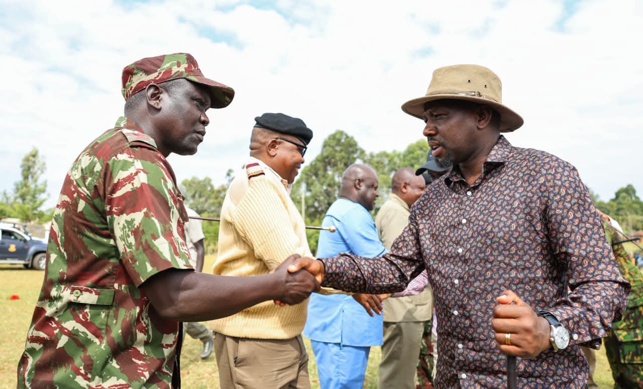 CS Kipchumba Murkomen greets DIG Gilbert Masengeli