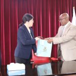 VC Prof. Isaac Kibwage handing a gift to the Nanjing Agricultural University Vice President Prof. FENG Shuyi