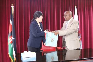 VC Prof. Isaac Kibwage handing a gift to the Nanjing Agricultural University Vice President Prof. FENG Shuyi