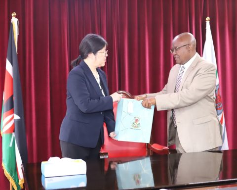 VC Prof. Isaac Kibwage handing a gift to the Nanjing Agricultural University Vice President Prof. FENG Shuyi