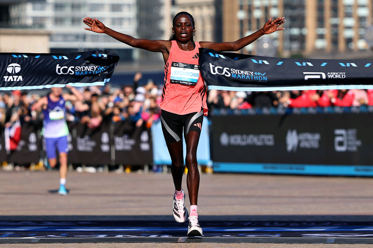 Kenyan athlete Peres Jepchirchir gestures after winning Sydney Marathon 