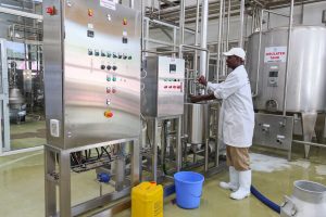 A man operating a milk cooler in Nandi County
