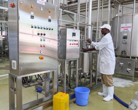 A man operating a milk cooler in Nandi County