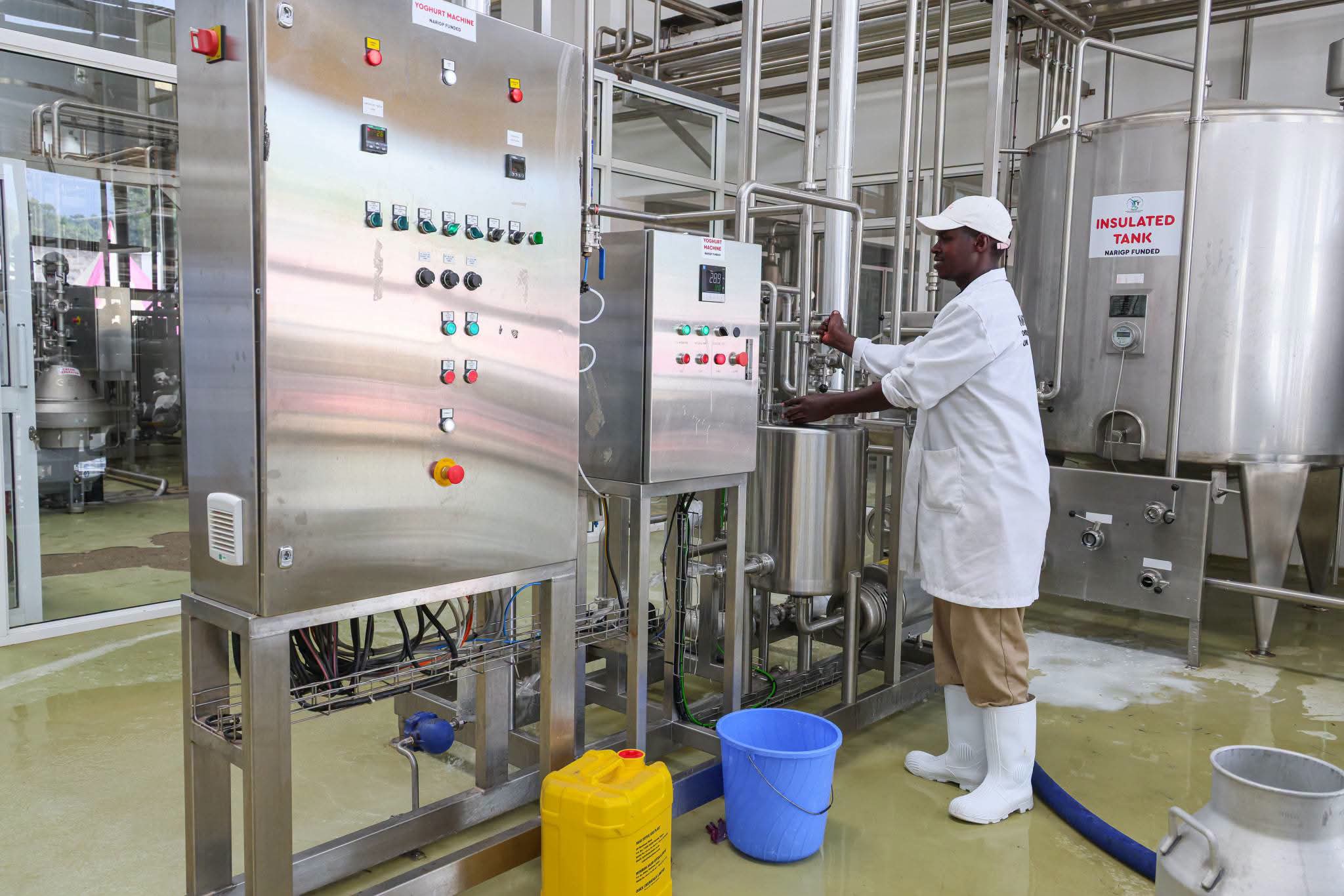 A man operating a milk cooler in Nandi County