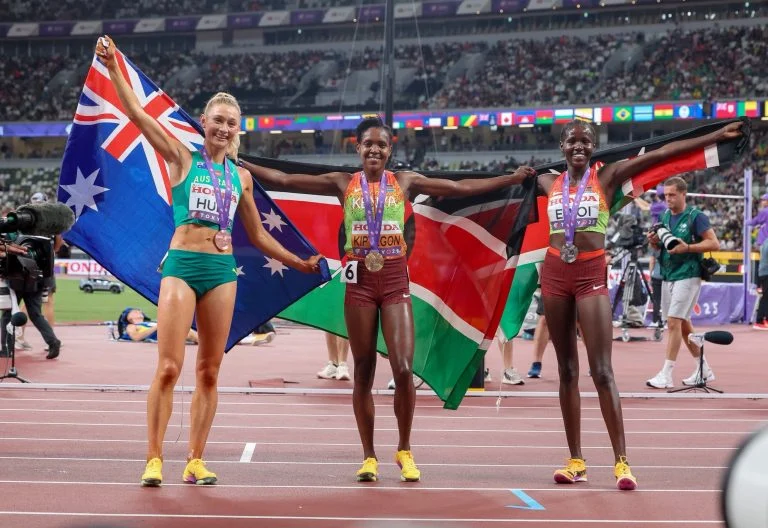 Australia’s Jess Hull with Kenya’s Faith Kipyegon and Dorcus Ewoi celebrate after the women’s 1500m final at the World Athletics Championships in Tokyo.