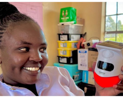 Mary Muigai showcasing the game-changing Solar Alert Security System
