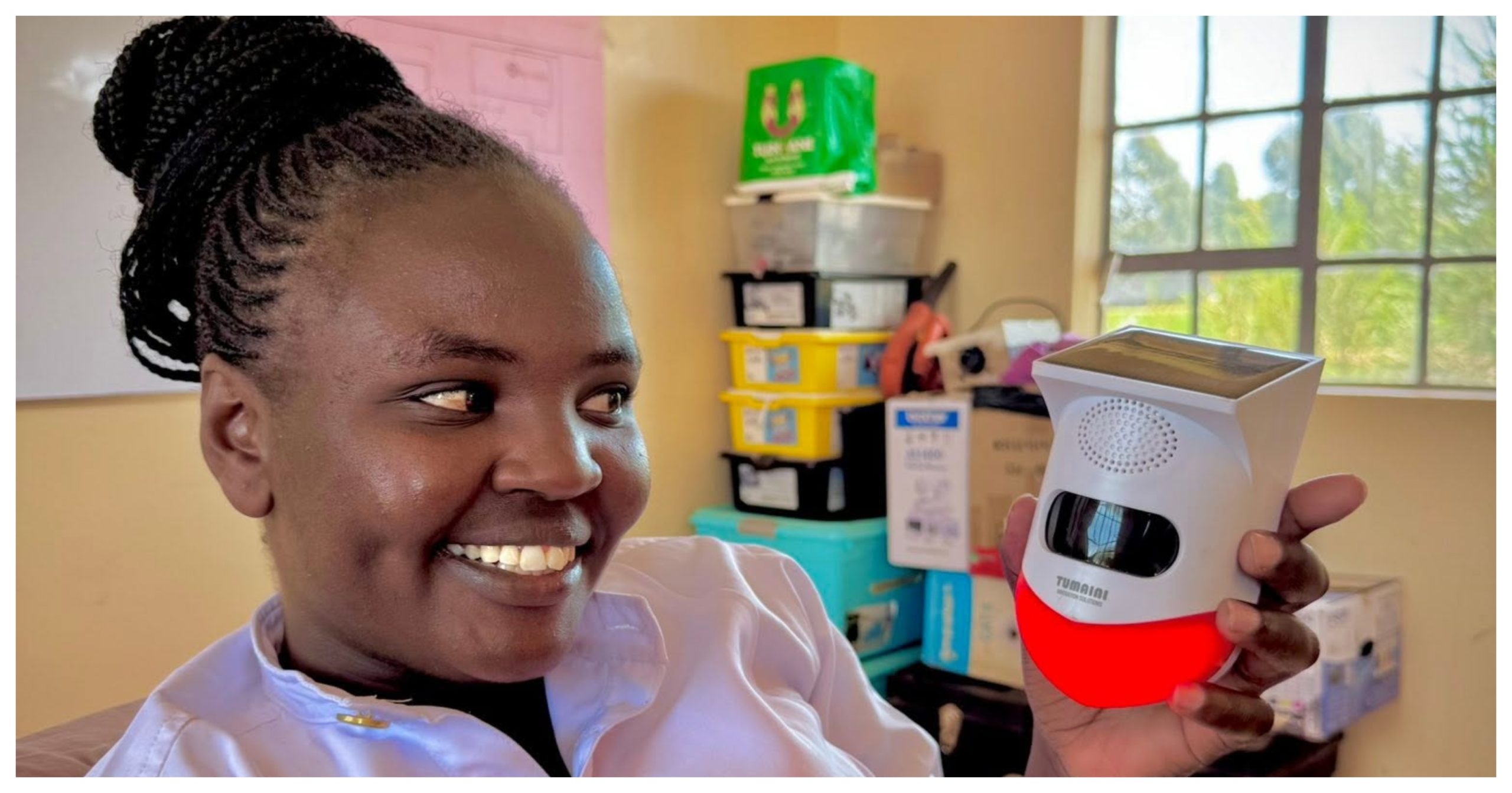 Mary Muigai showcasing the game-changing Solar Alert Security System