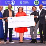 KWAL’s Commercial Director, Alice Mwalimo, leads the team in handing over a Ksh 10 million cheque to Standard Chartered’s Head of Corporate Affairs, Brand & Marketing (CABM) for Kenya & Africa, Joyce Kibe (far left), and Standard Chartered Nairobi Marathon Local Organizing Committee member David Mwindi (far right)