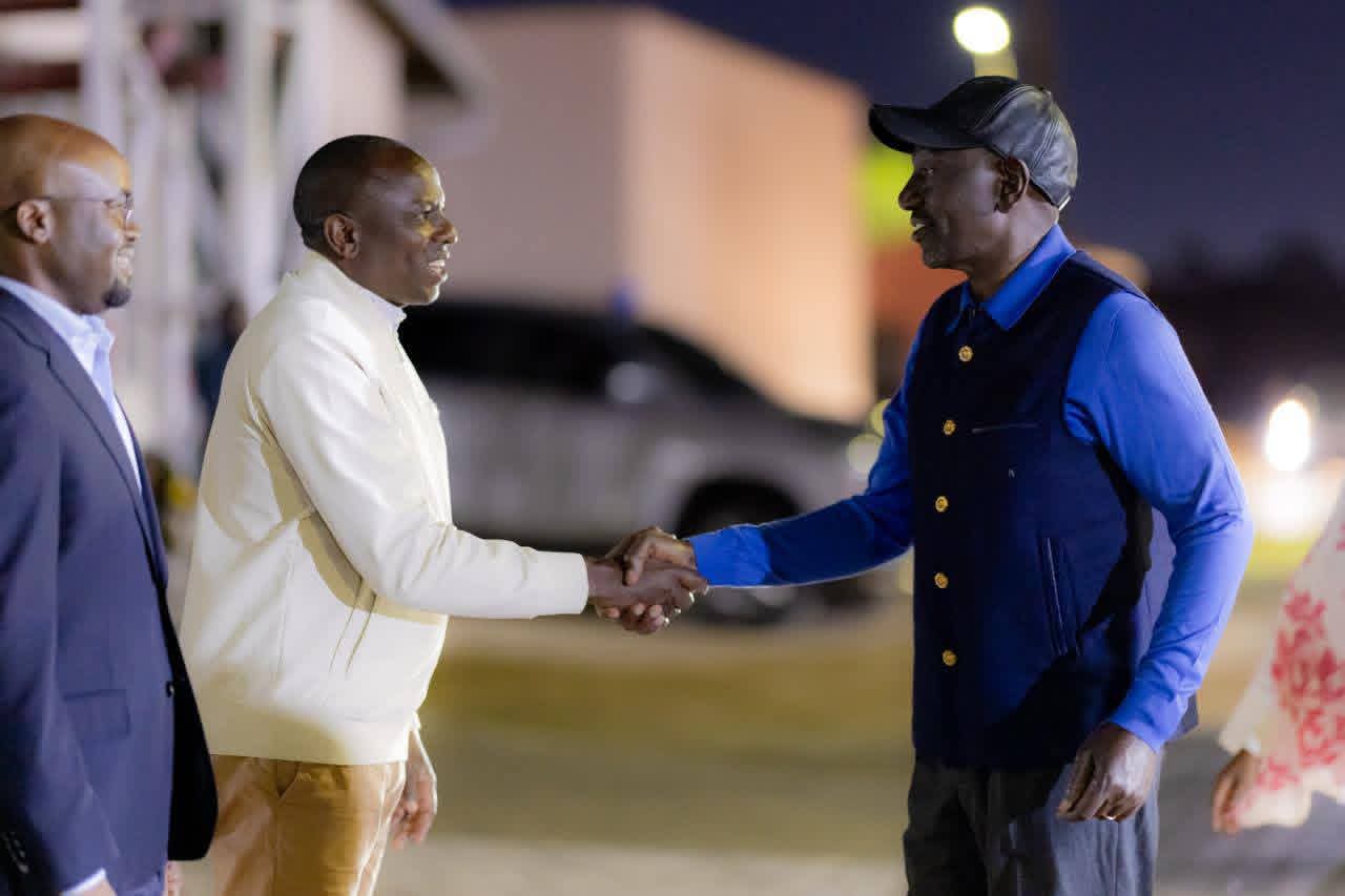 President William Ruto greets Kikuyu MP Kimani Ichungwa at JKIA