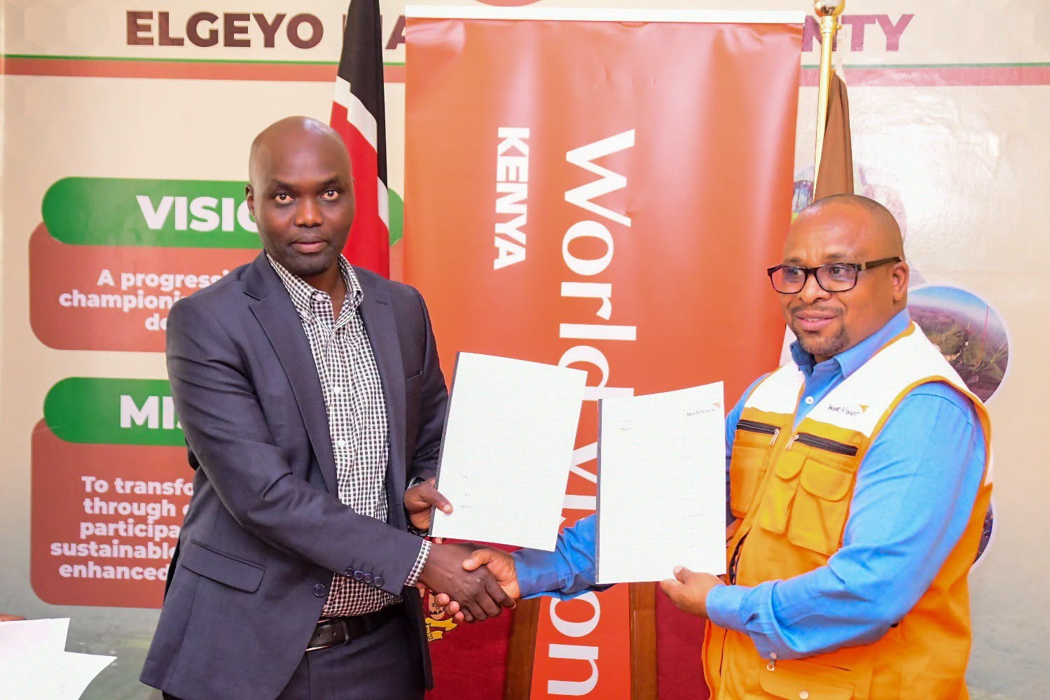 Elgeyo Marakwet Governor Wisley Rotich﻿ (left) with World Vision Interim National Director Dr Gershon Mwakazi.
