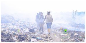 People walking in a land fill in Africa