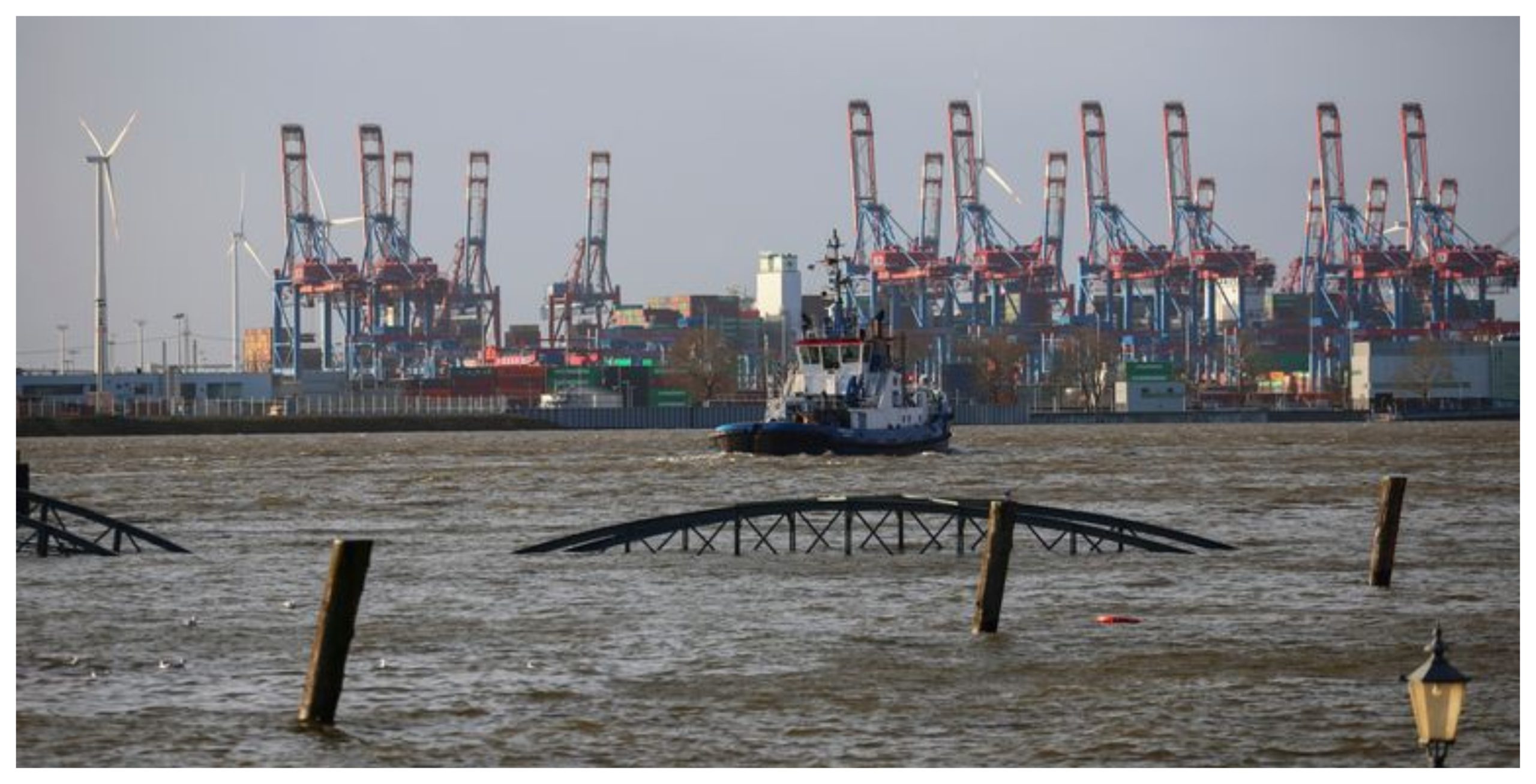 In Hamburg, the Elbe River flooded streets around the city's fish market, with water waist-high in places.