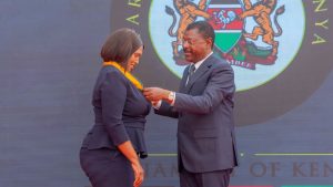 Speaker Wetang'ula presenting a medal to Nakuru Senator Tabitha Keroche Karanja.