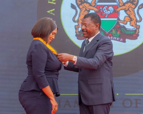 Speaker Wetang'ula presenting a medal to Nakuru Senator Tabitha Keroche Karanja.